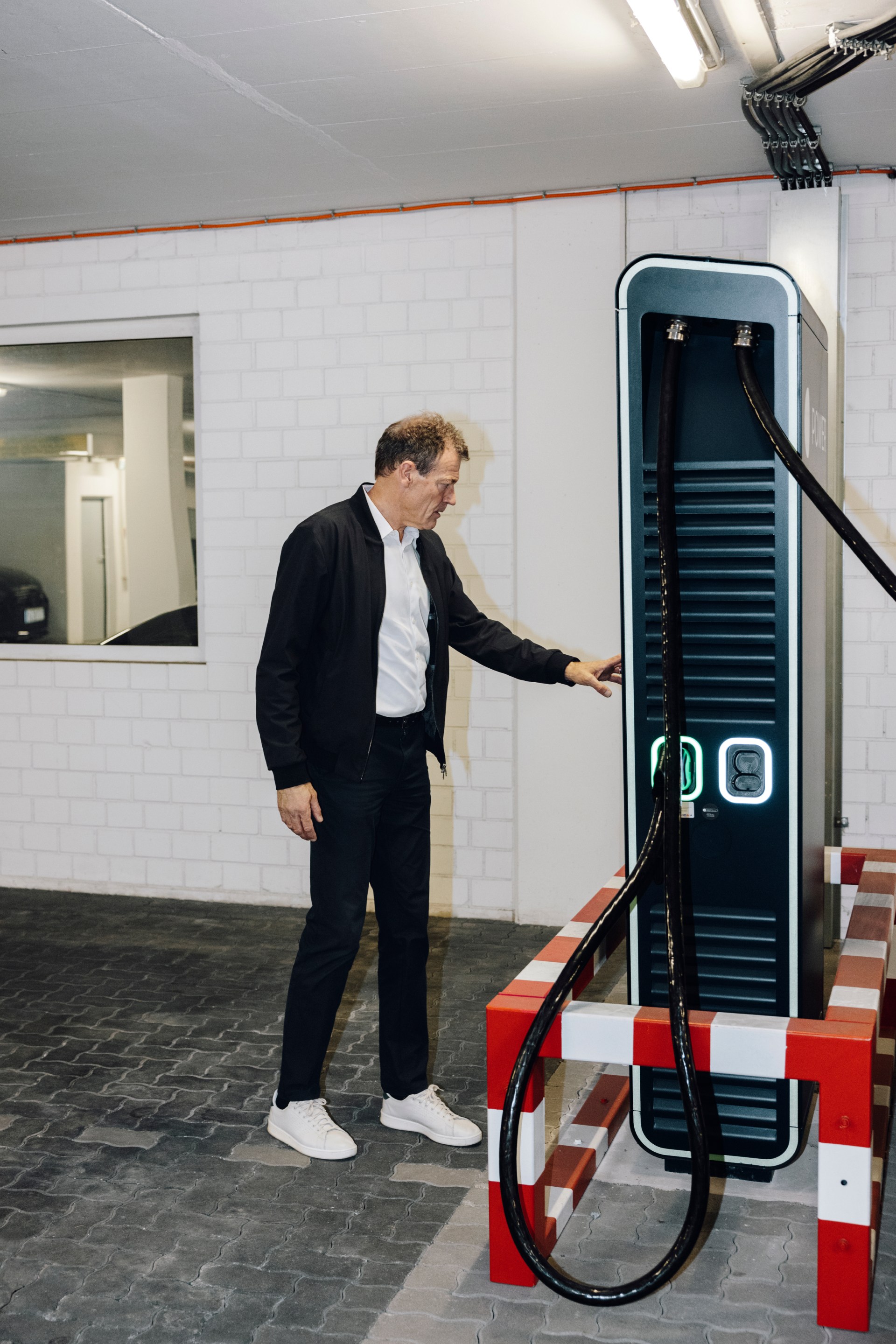 Andreas Jung operates a quick-charging station.